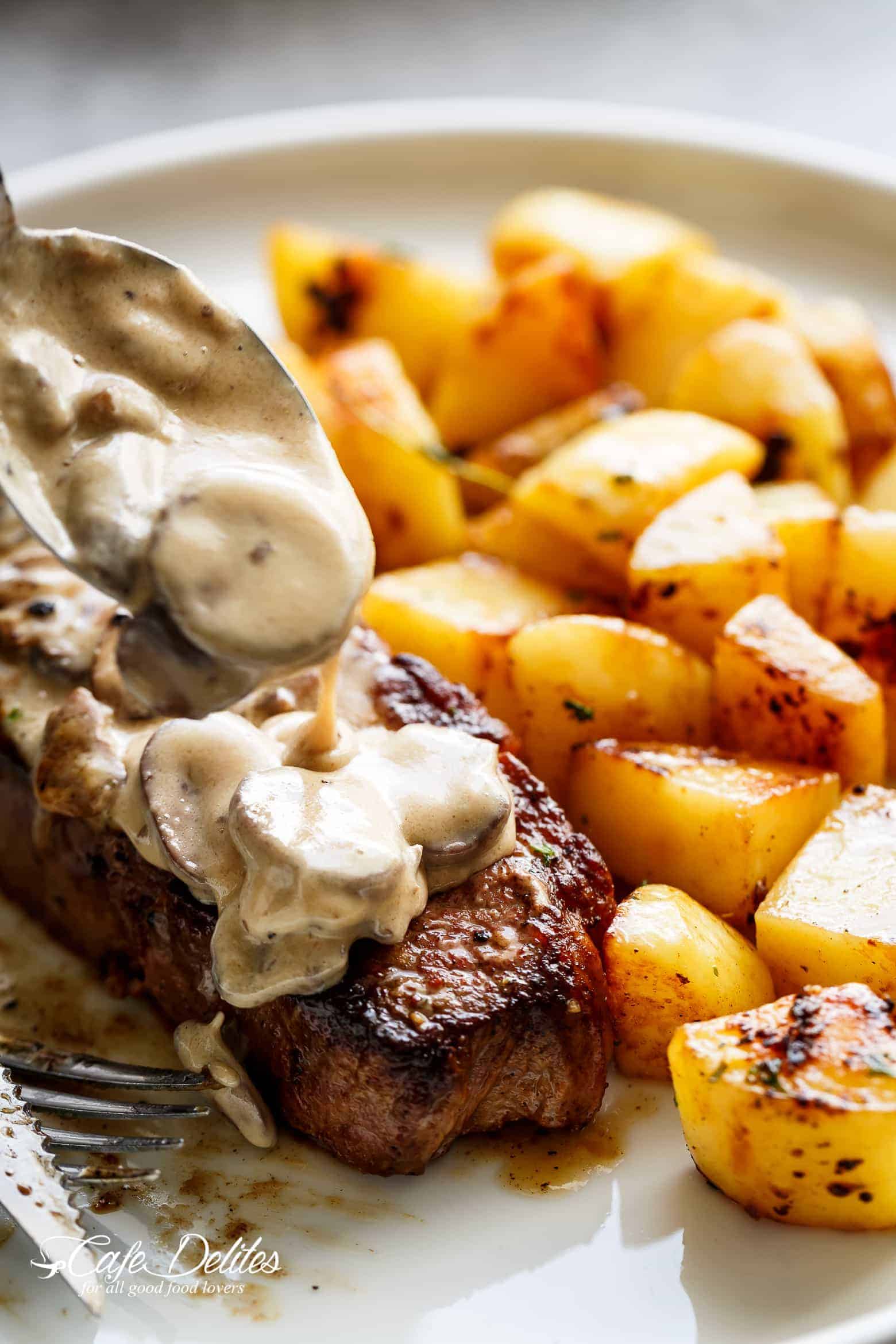 Pan Seared Garlic Butter Steak & Mushroom Cream Sauce is a perfect dinner! A little butter adds something special to your steak in less than 10 minutes! | cafedelites.com