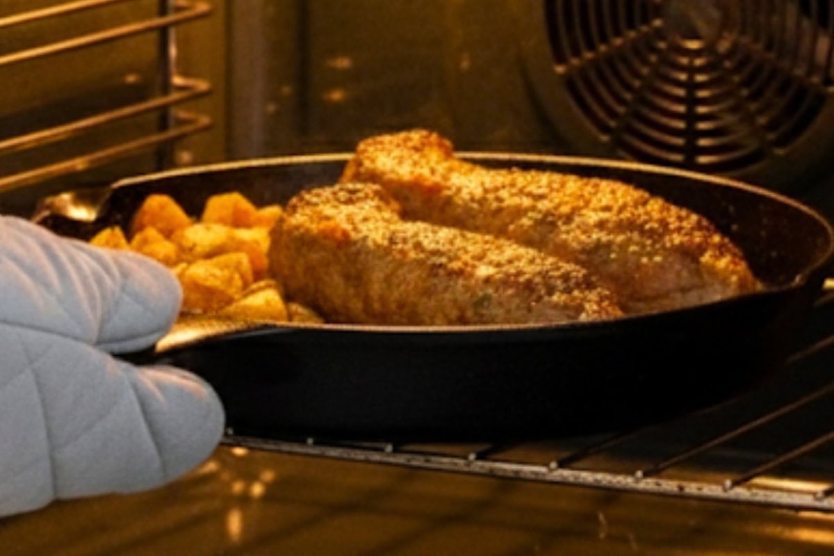 Brush pork with the reserved sauce; sprinkle rosemary and move skillet to the oven.