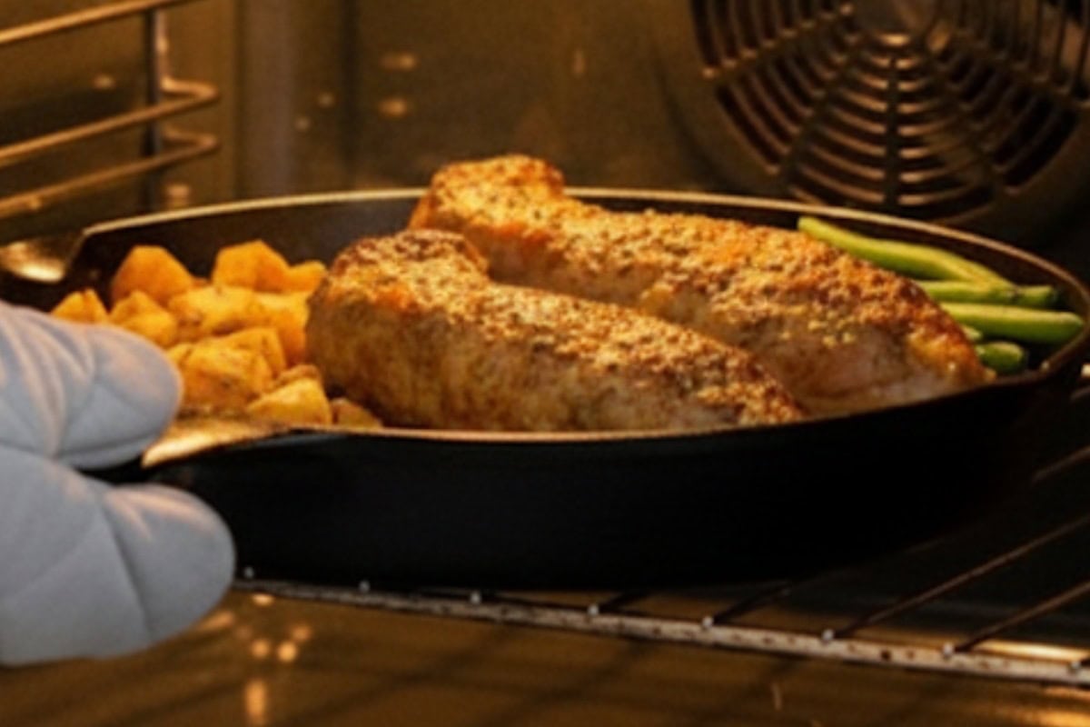 Remove pan from oven and scatter green beans around; return to oven and cook until beans are tender.