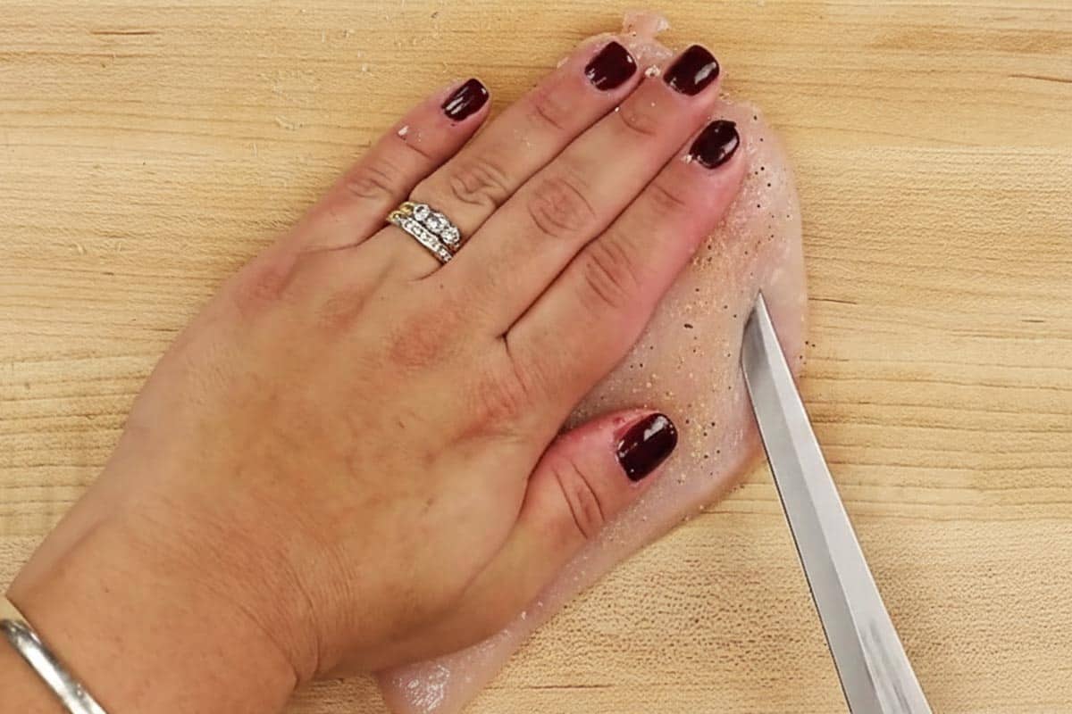 Slicing a pocket in the chicken. - 4