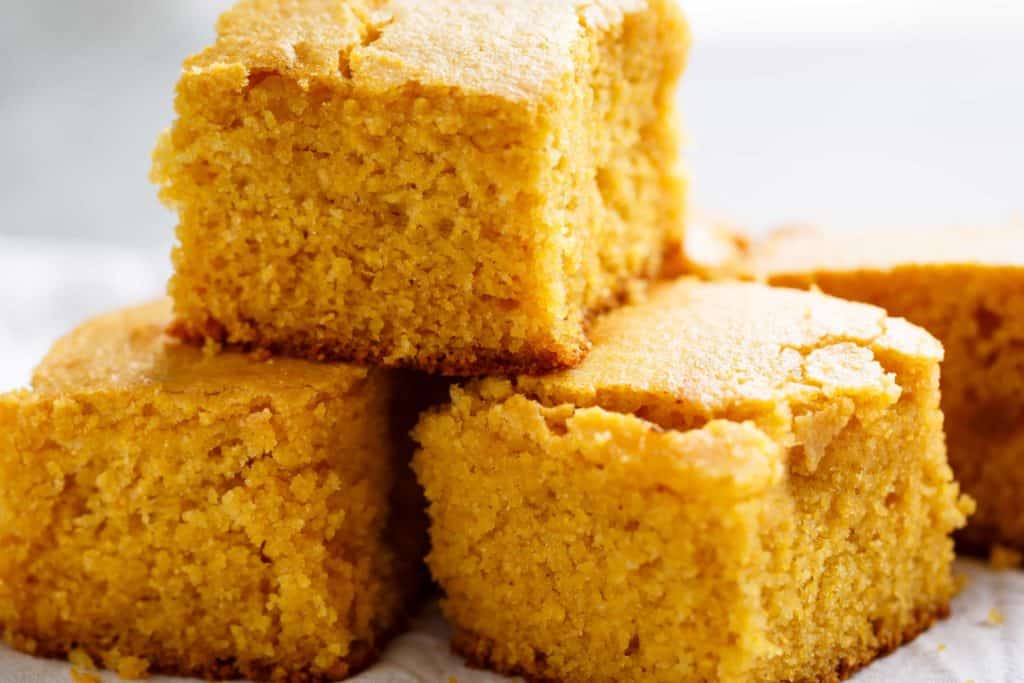Easy Buttermilk Cornbread with a hint of honey is the perfect side to chili's, soups or stews! Crunchy buttery edges with a soft and fluffy centre!