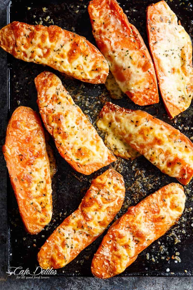  Warm Mozzarella cheese and parmesan top these tender garlic butter smothered sweet potato Cheesy Garlic Sweet Potatoes