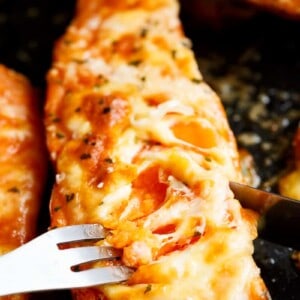 Mozzarella cheese and parmesan top these tender garlic butter smothered sweet potatoes!