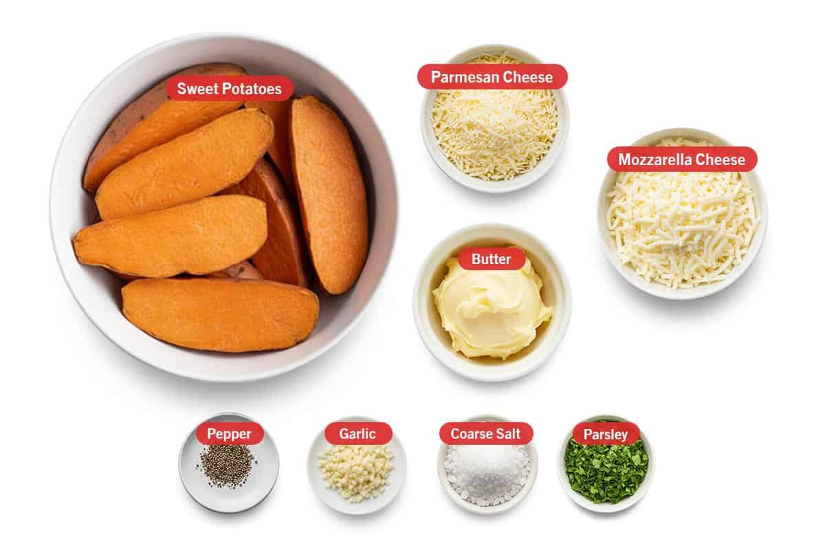 Top shot of ingredients: Sweet potatoes, parmesan cheese, butter, mozzarella cheese, pepper, garlic, coarse salt, and parsley.