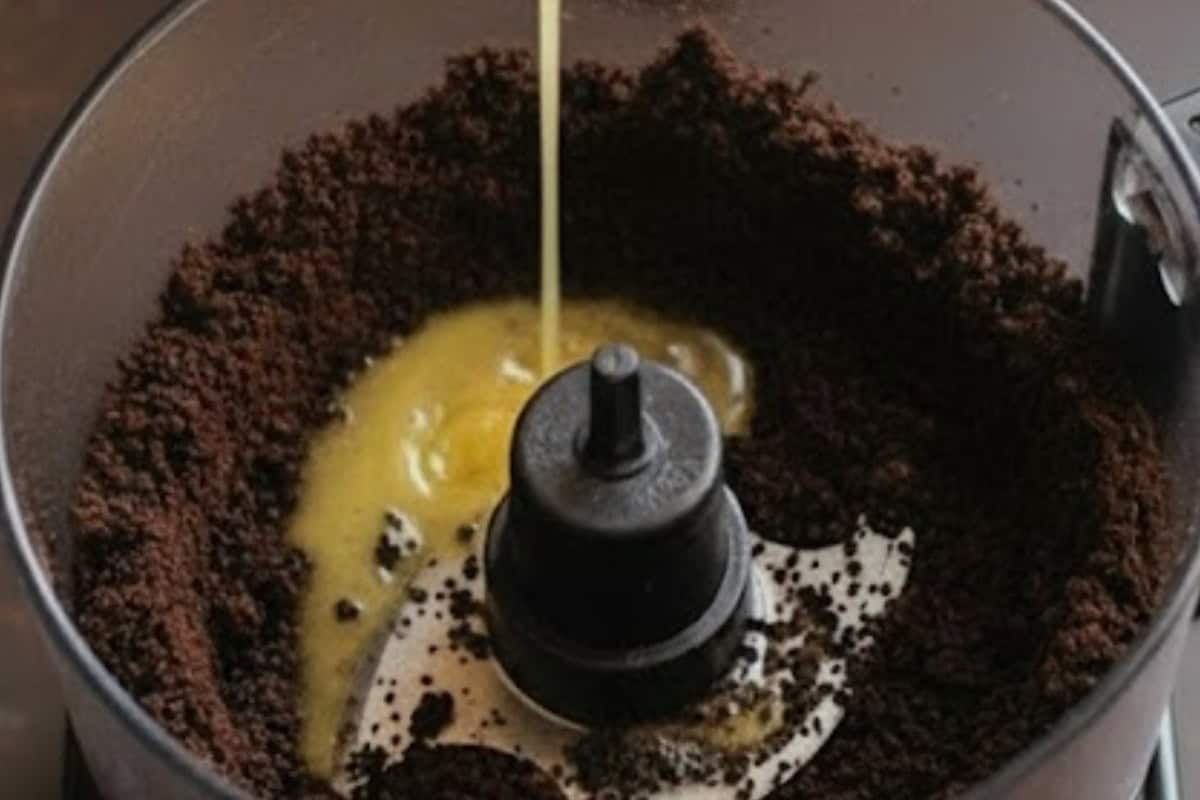 Pulse the Oreos in a food processor until they form fine crumbs, then add the melted butter. - 4