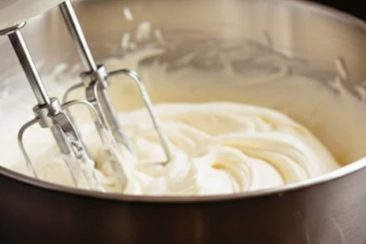 Just before serving, beat the cold cream and sugar together until soft peaks form. Add bourbon and vanilla - 9