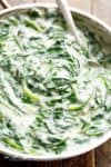 Easy Creamed Spinach does not get easier! This simple homemade side dish is so much better than store bought, and is ready in no time! | Cafe Delites