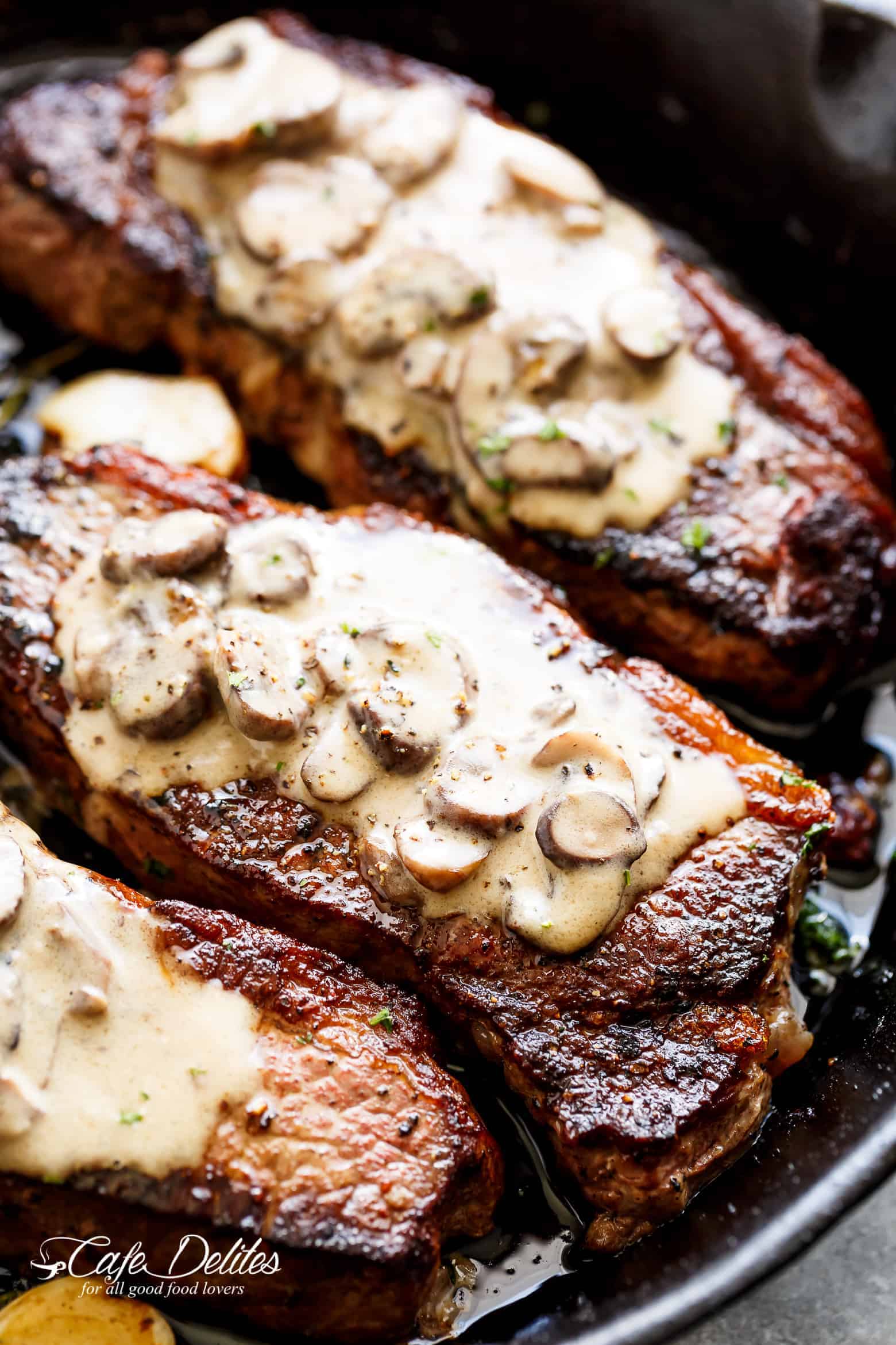 Pan Seared Garlic Butter Steak & Mushroom Cream Sauce is a perfect dinner! A little butter adds something special to your steak in less than 10 minutes! | cafedelites.com