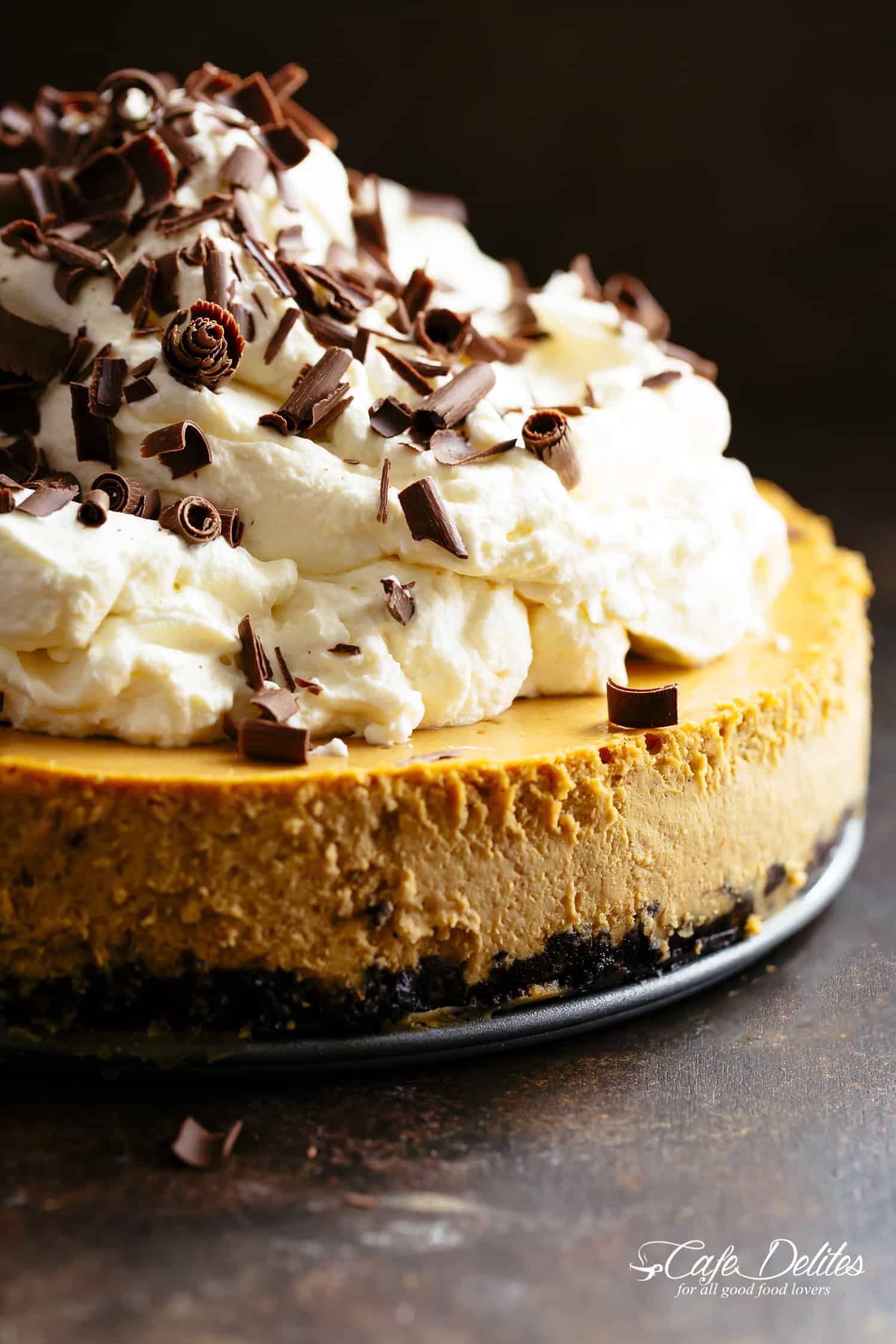 Pumpkin Cheesecake with a chocolate Oreo base and bourbon whipped cream Chocolate Pumpkin Cheesecake