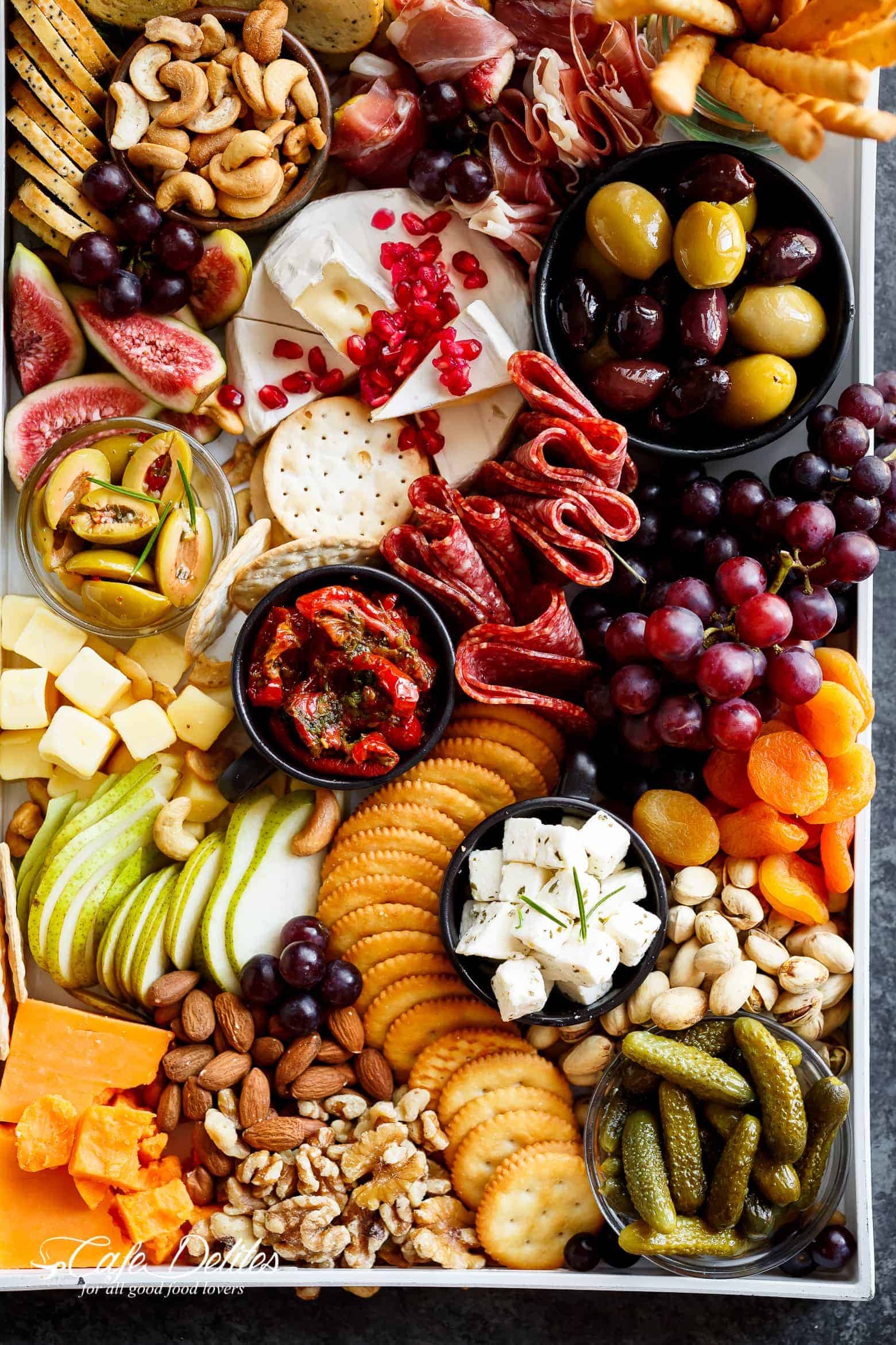 A Loaded Thanksgiving Cheeseboard to kick off your day/night with an easy and quick, throw together cheeseboard that requires zero skill and no prep work! | Cafe Delites