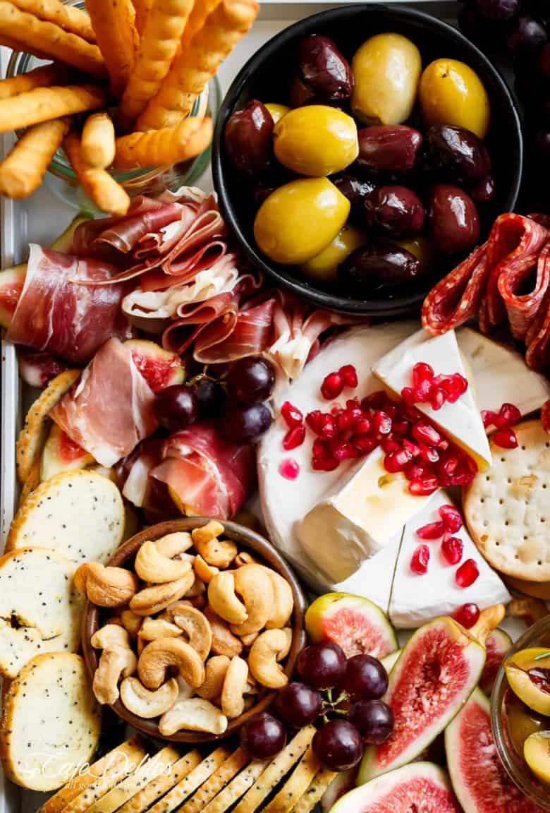 A Loaded Thanksgiving Cheeseboard to kick off your day/night with an easy and quick, throw together cheeseboard that requires zero skill and no prep work! | Cafe Delites
