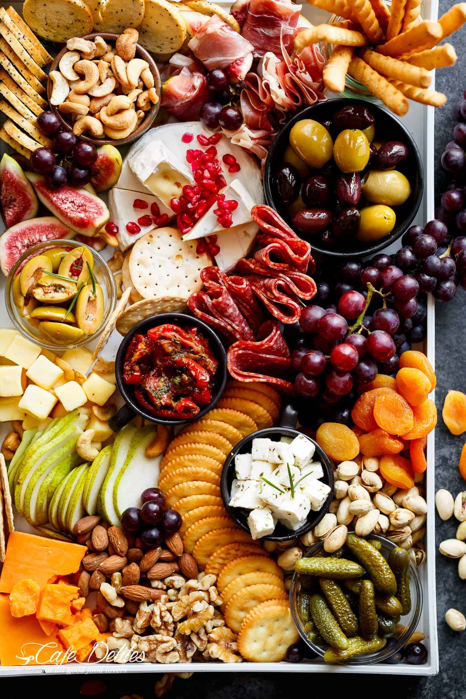 A large plater covered with charcuterie. 