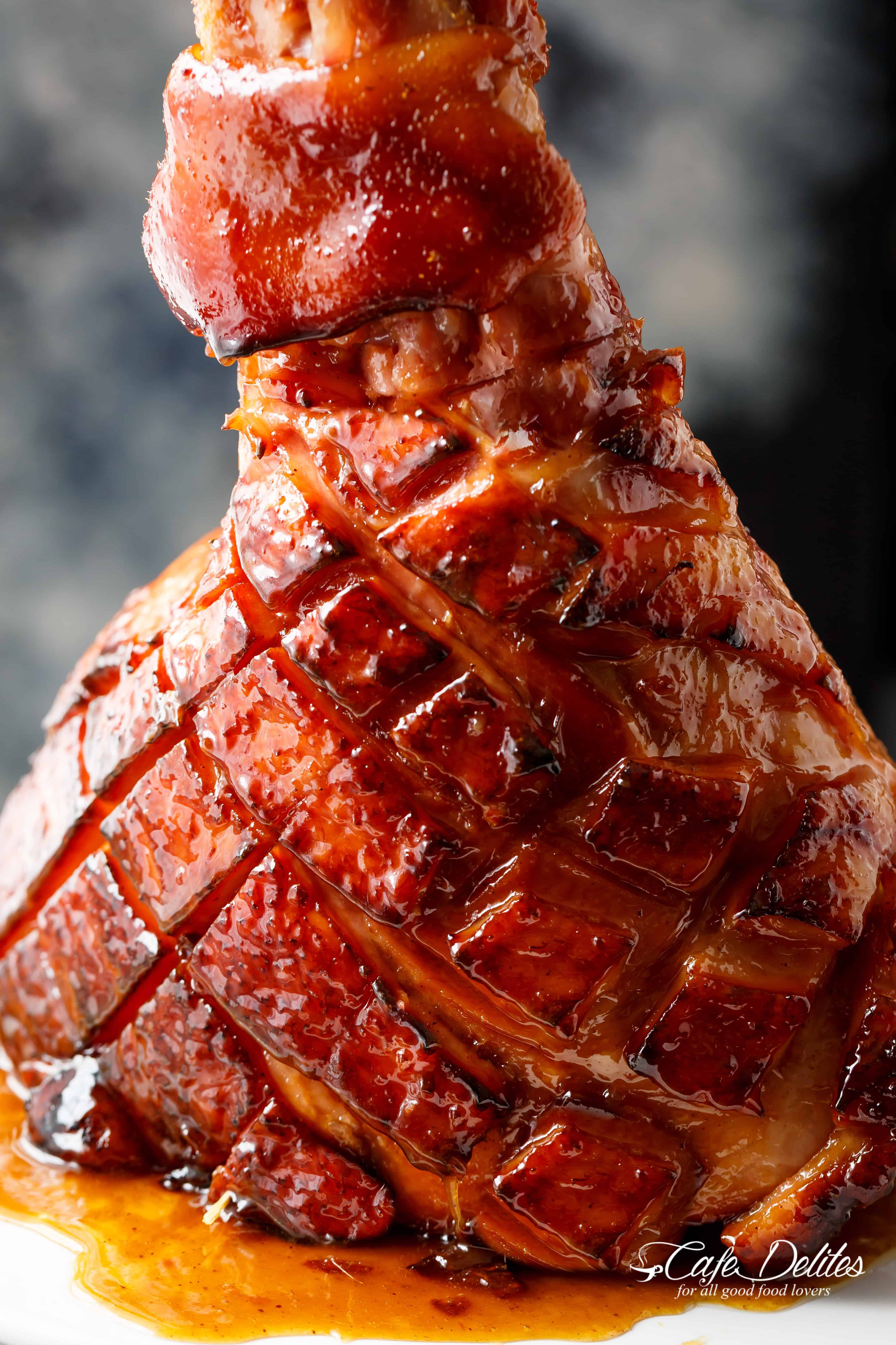 The most perfect sticky glaze is slathered all over this juicy, tender Brown Sugar Mustard Glazed Ham, with crisp edges and an incredible flavour! | cafedelites.com