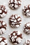 Fudgy Chocolate Crinkle Cookies have an irresistible brownie textured centre, with a crunch of cookie on the outside! One of our favourite Christmas cookies right here! ONLY 88 calories EACH! | https://cafedelites.com