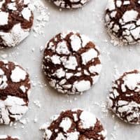 Fudgy Chocolate Crinkle Cookies have an irresistible brownie textured centre, with a crunch of cookie on the outside! One of our favourite Christmas cookies right here! ONLY 88 calories EACH! | https://cafedelites.com