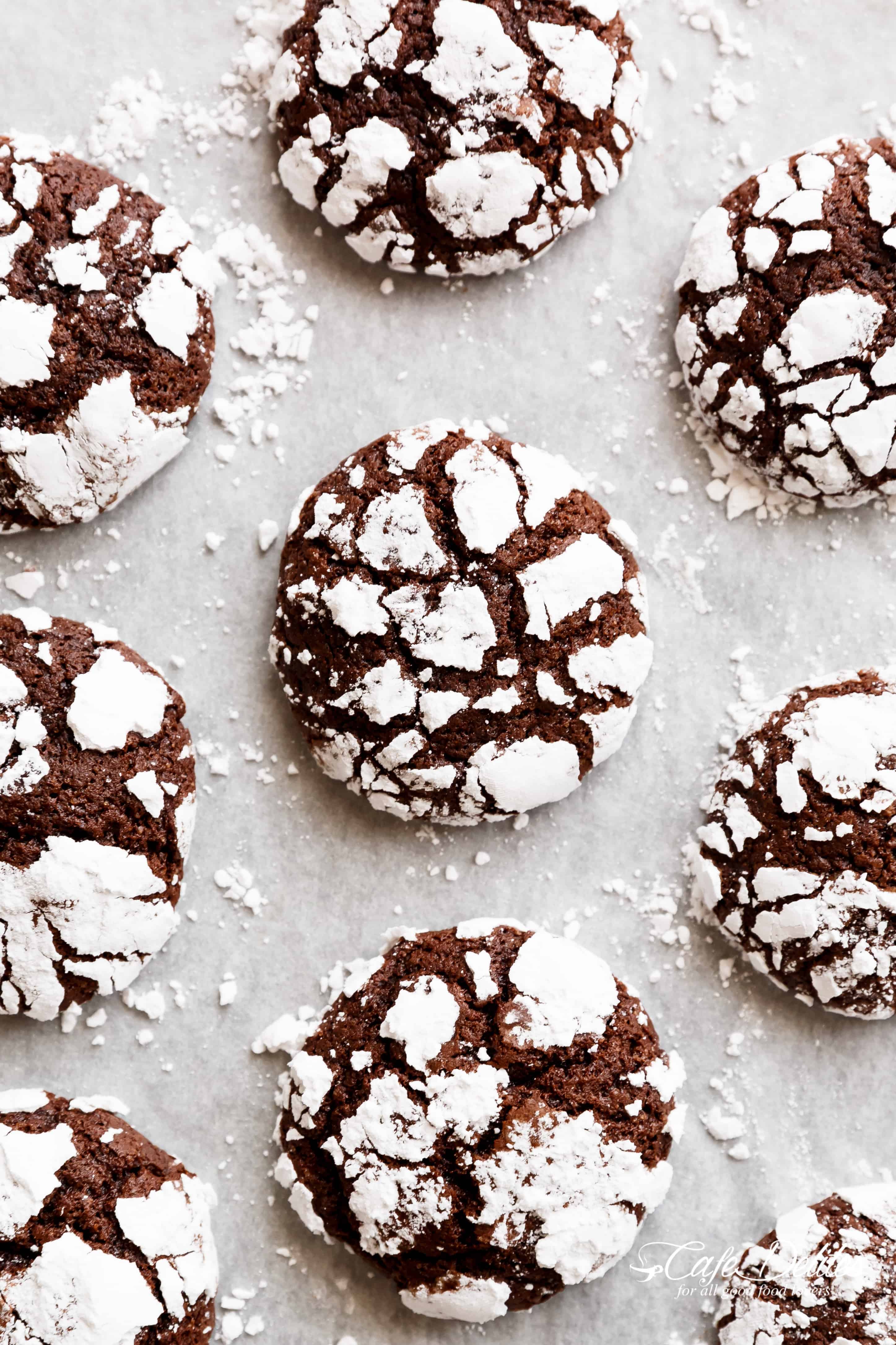 Fudgy Chocolate Crinkle Cookies have an irresistible brownie textured centre, with a crunch of cookie on the outside! One of our favourite Christmas cookies right here! ONLY 88 calories EACH! | https://cafedelites.com