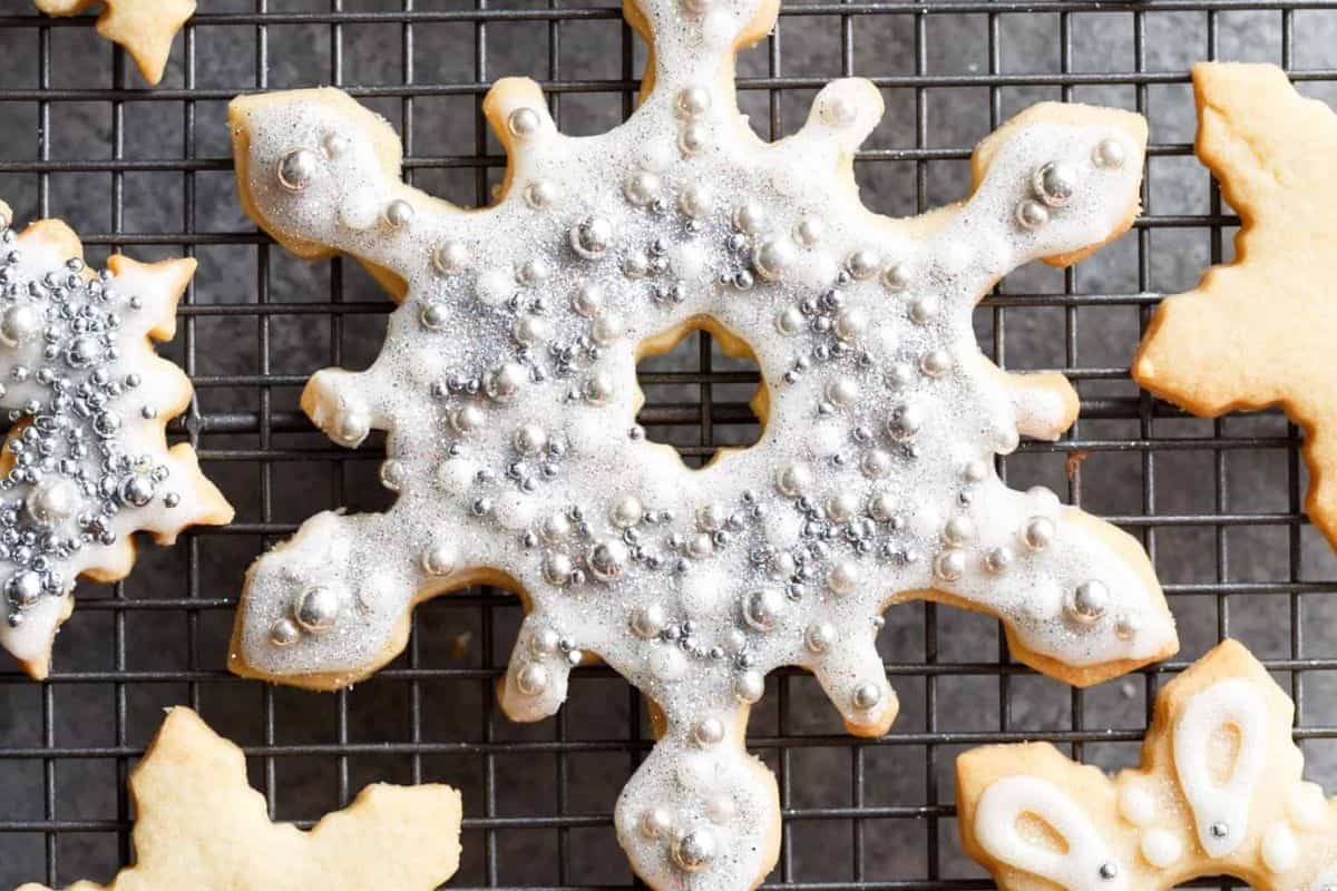 Outline and flood each cookie with the icing, then let set. Add details with a #1 tip or top with sprinkles, pearls, or edible glitter. Icing sets in 20 minutes in the fridge or 2 hours at room temp.