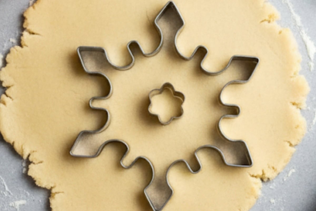 Use cookie cutters to shape the dough, then place on the prepared baking sheet.
