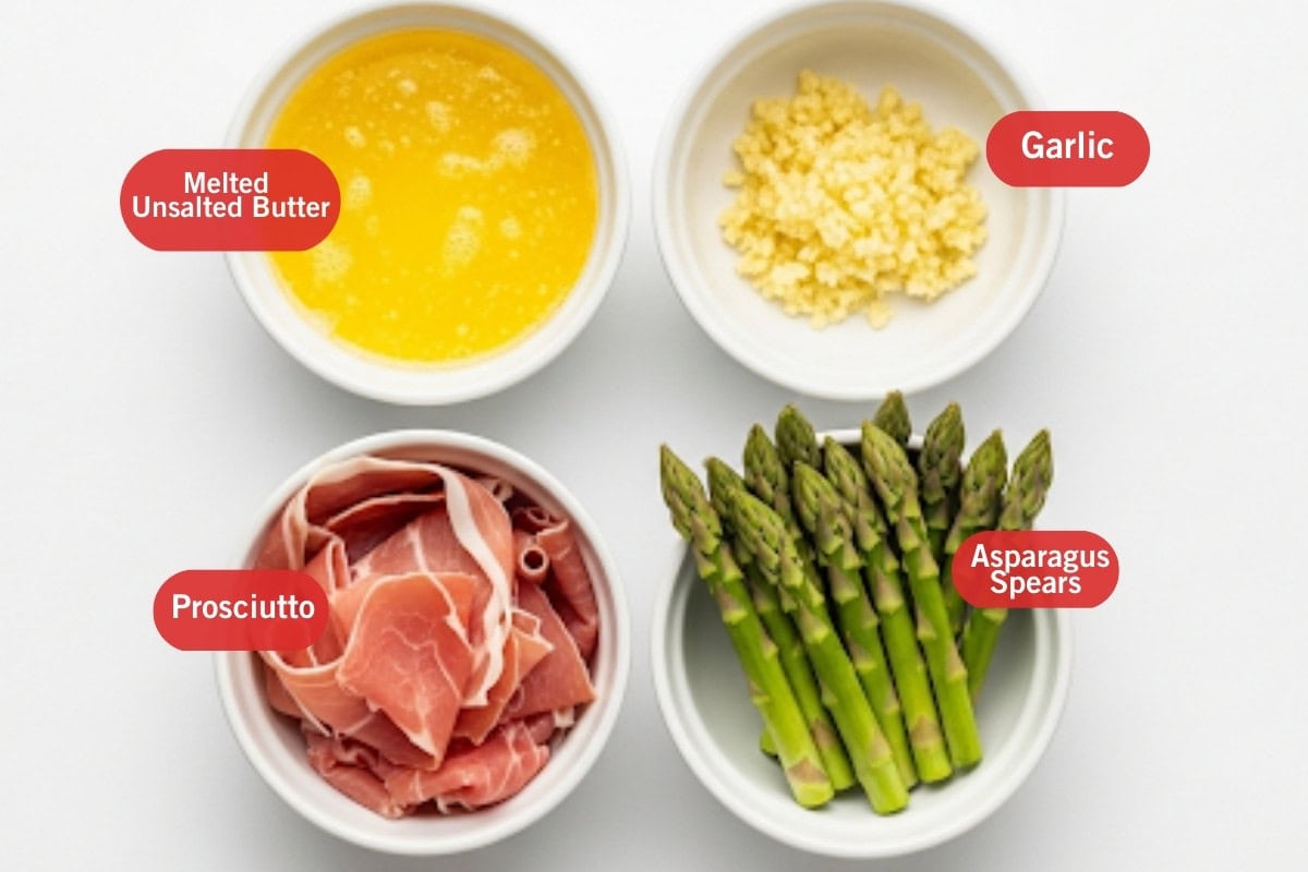 Flat lay photo of ingredient shot of melted unsalted butter, garlic, prosciutto, asparagus spears.