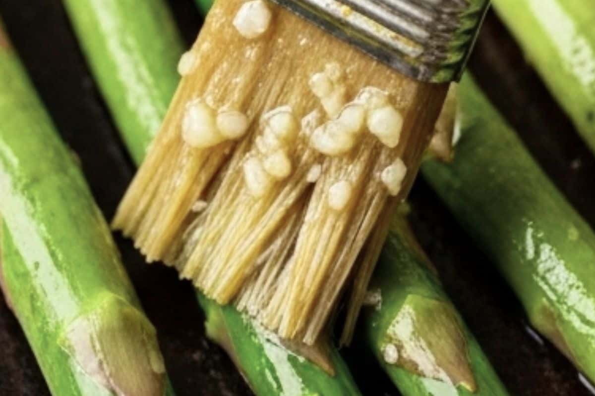 Brush each spear evenly with the garlic butter.