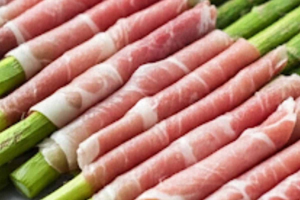 Wrap each spears with prosciutto