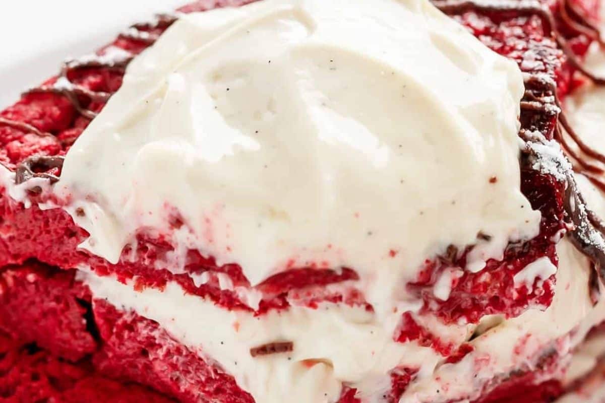 Plate the red velvet french toast while it is still warm so the filling stays creamy and soft.