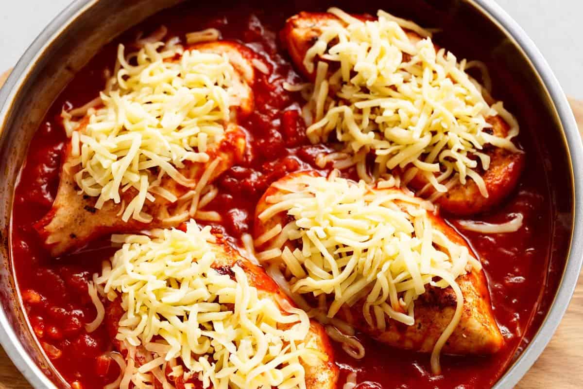 Chicken in the sauce with cheese at the top