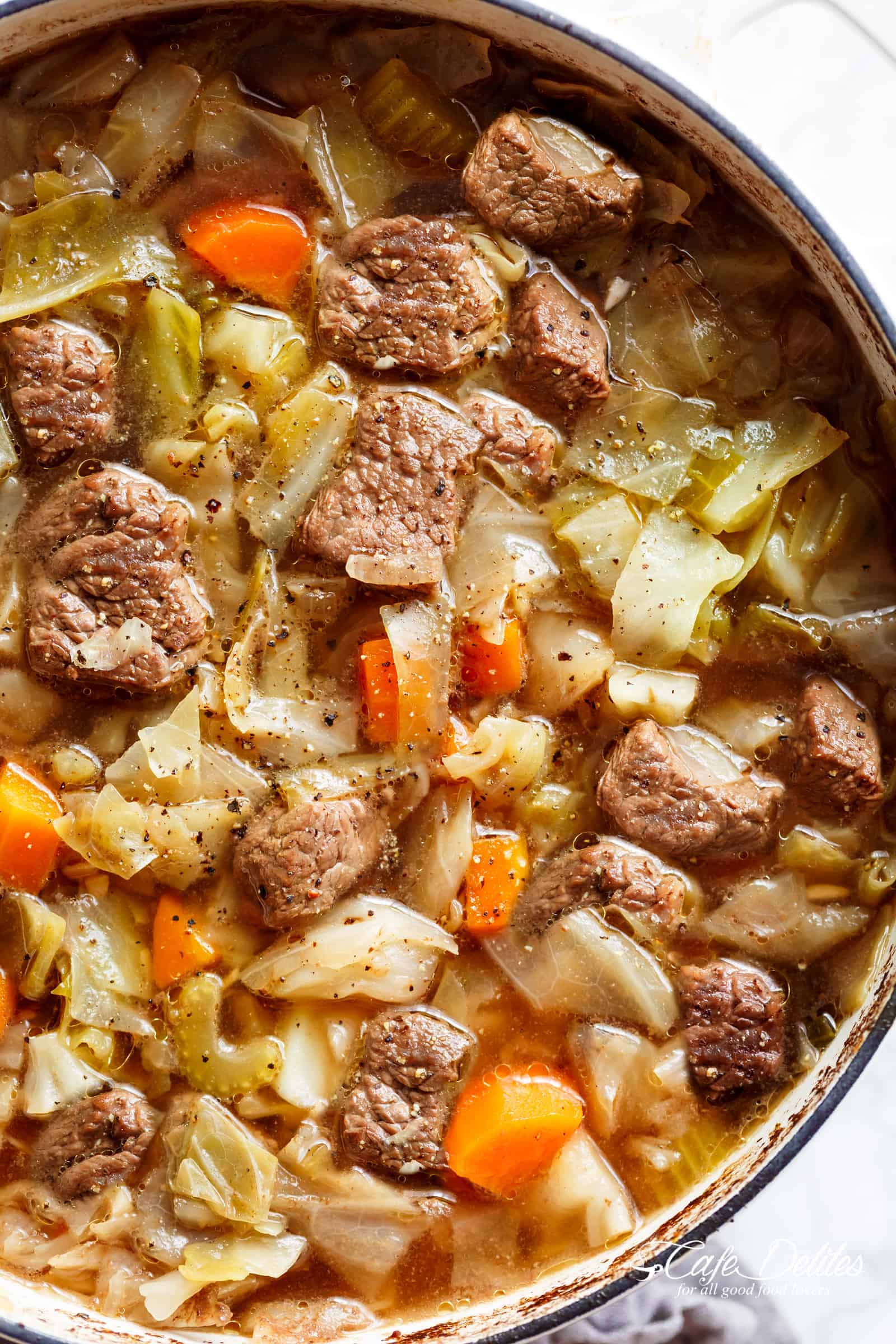 Beef Cabbage Soup is quick to make, healthy, low in carbs and full of delicious flavour! Made with minimal ingredients, full of cabbage, carrots, onions, garlic and tender, fall apart beef! Low fat, low carb, healthy, diet approved and so super filling you won't believe how good this is! | cafedelites.com