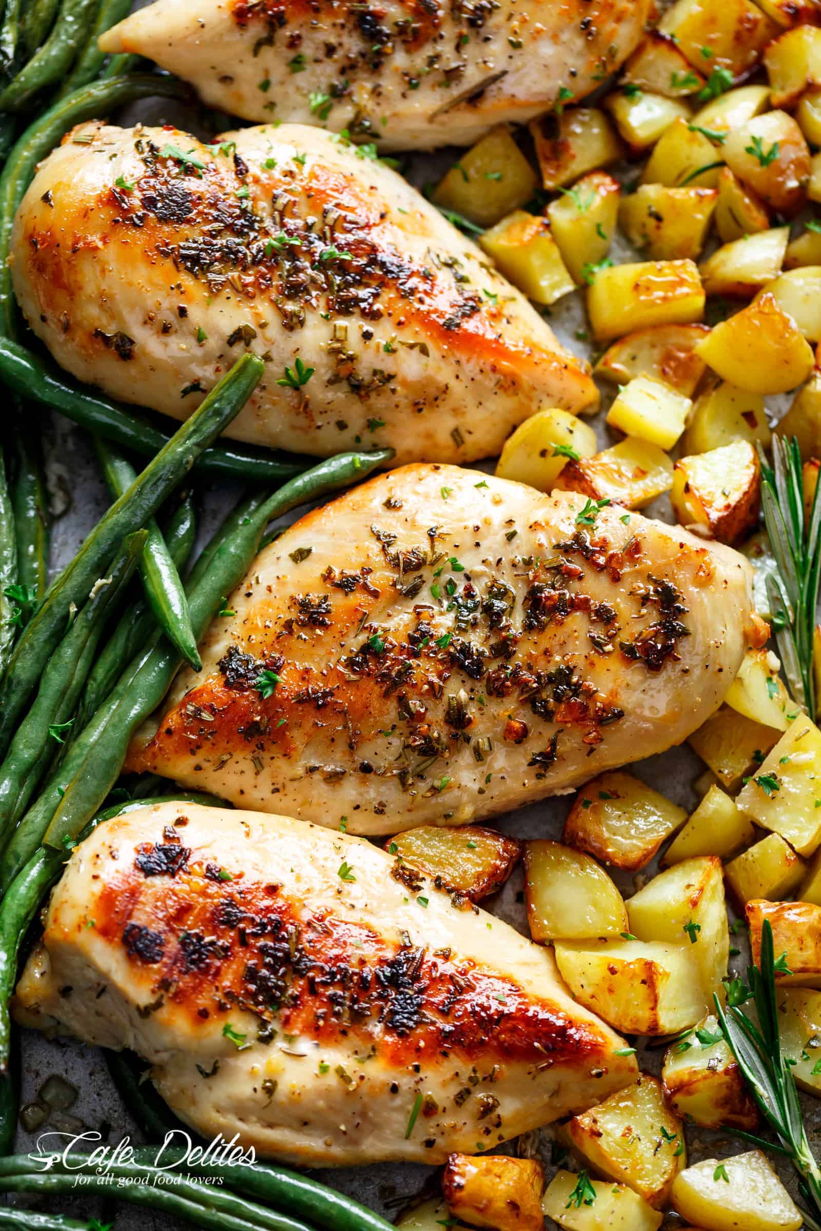 Sheet Pan Garlic Herb Butter Chicken has half the butter and fat WITHOUT compromising on a buttery flavour. A complete sheet pan chicken dinner with roasted potatoes and green beans! | cafedelites.com