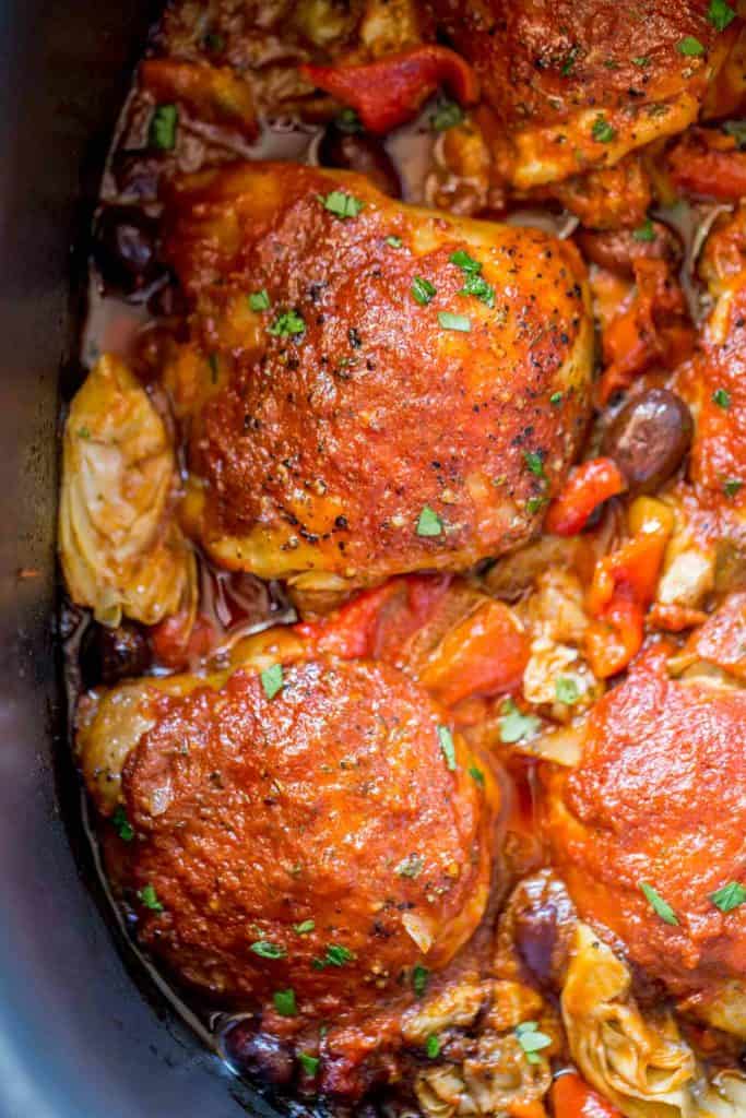 Cooked Chicken in Slow cooker with olives and artichokes.