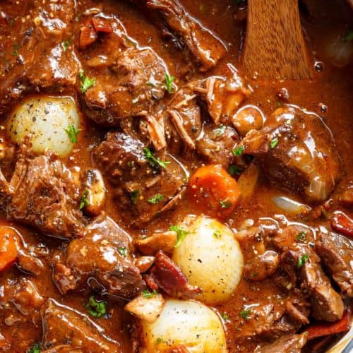 Tender fall apart chunks of beef simmered in a rich red wine gravy makes Julia Child Beef Bourguignon (Julia Child Recipe)
