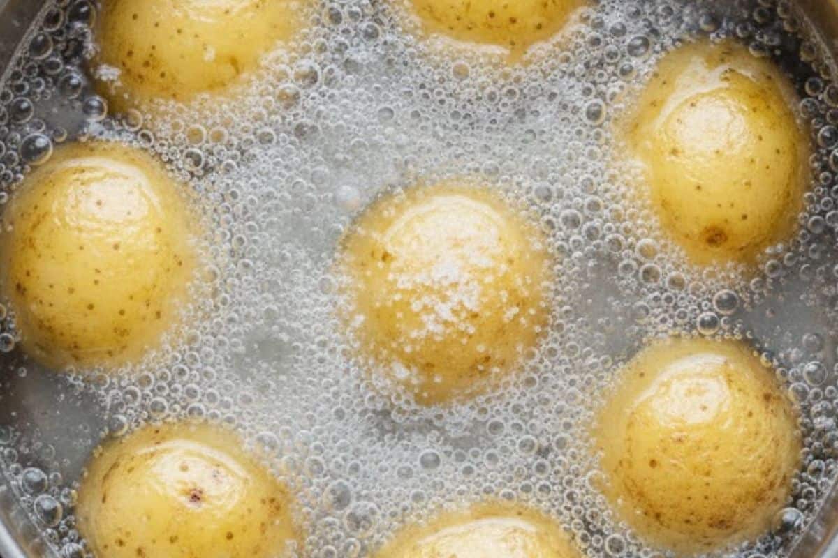 Add the potatoes to a pot of water with lots of salt. Bring this to a boil.