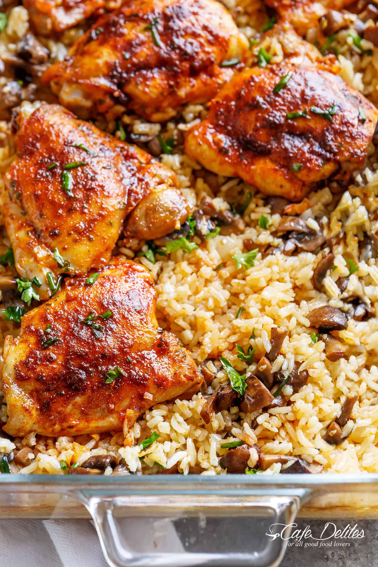 Oven Baked Chicken And Rice with ALL the chicken flavours baked right in! Dinner doesn't get any easier! | https://cafedelites.com