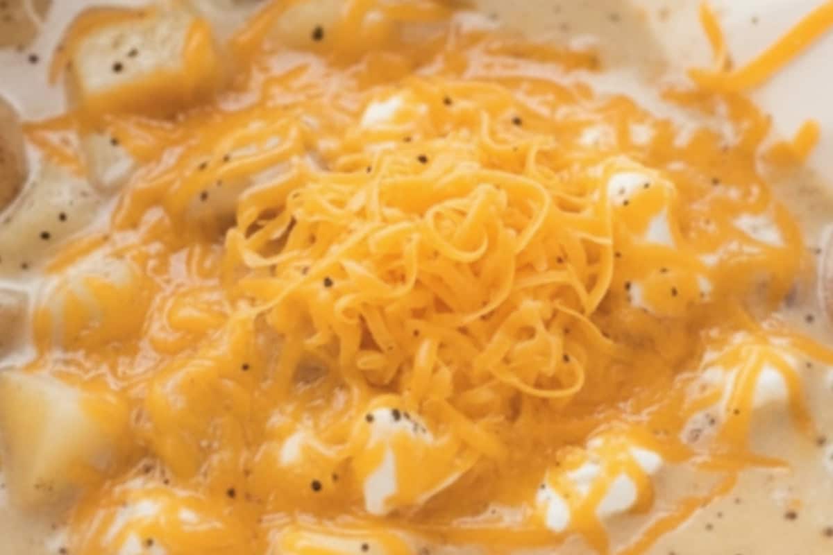 Stir in cream cheese, milk-cornstarch mixture, cheddar, salt, pepper, and celery seeds, then cover again.
