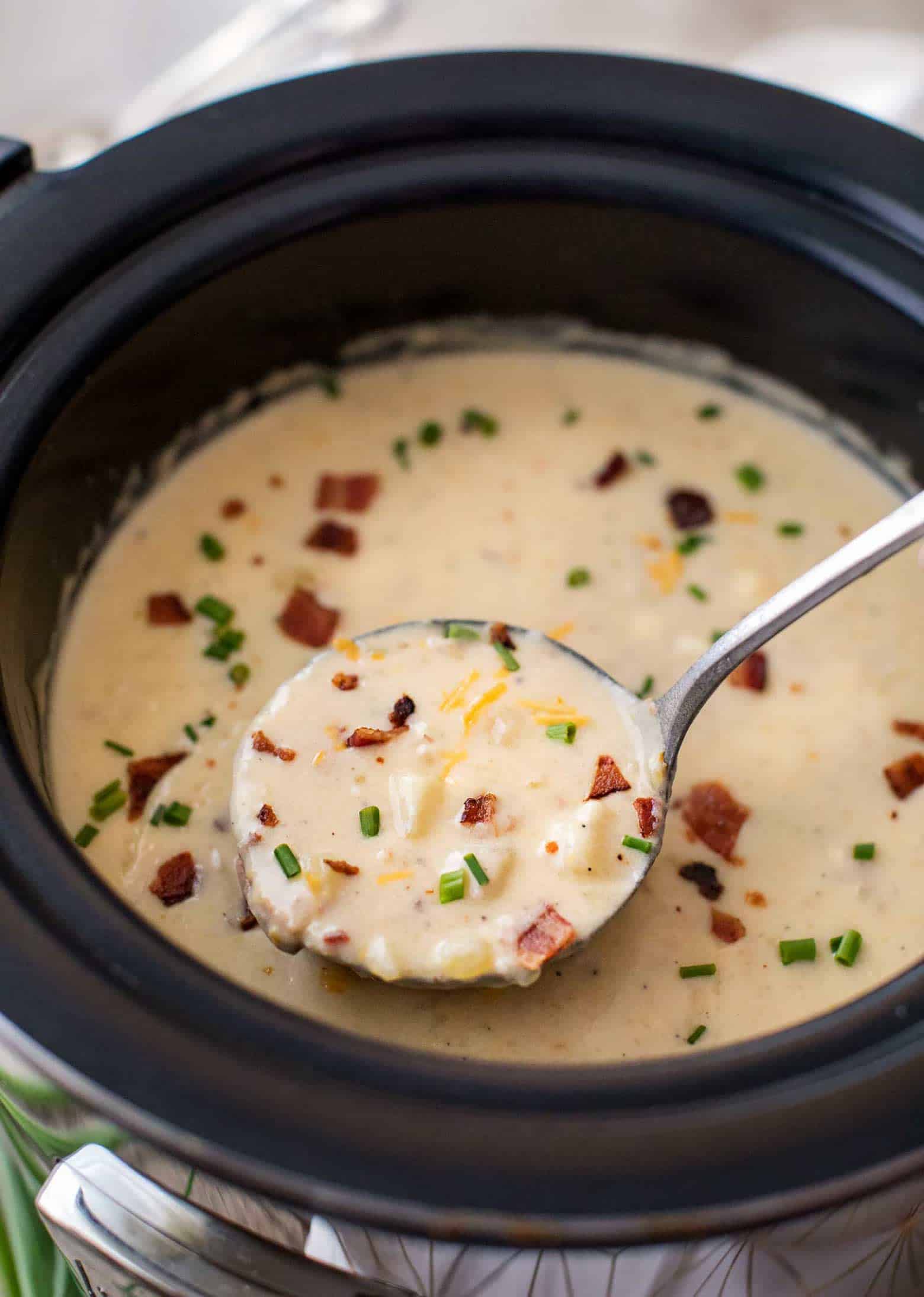 Ladle of skinny slow cooker potato soup
