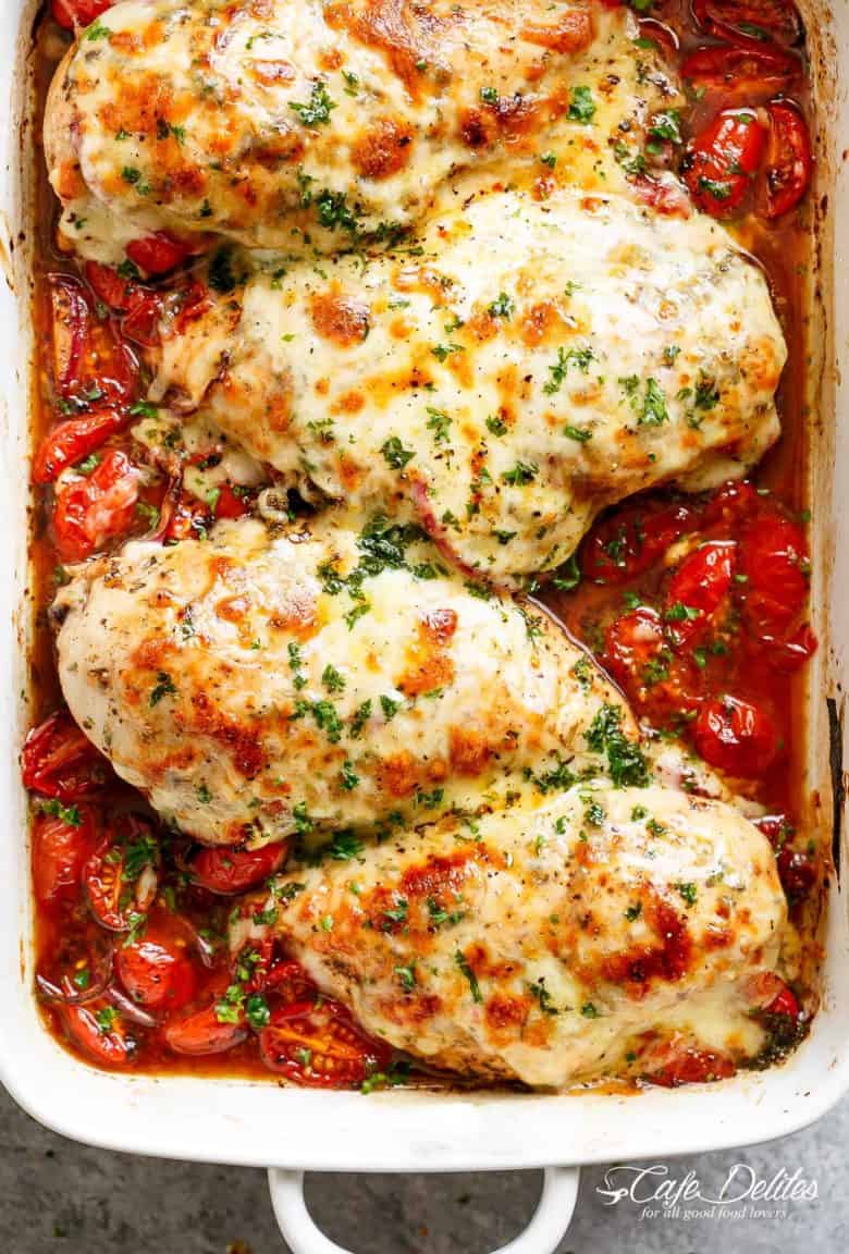 Baked Chicken Breast rubbed with garlic and herbs, dripping with a tomato balsamic sauce and melted mozzarella cheese! It doesn't get any better than this EASY chicken recipe! Let your oven do ALL the work and have the most delicious Baked Chicken on your table in less than 30 minutes! | https://cafedelites.com
