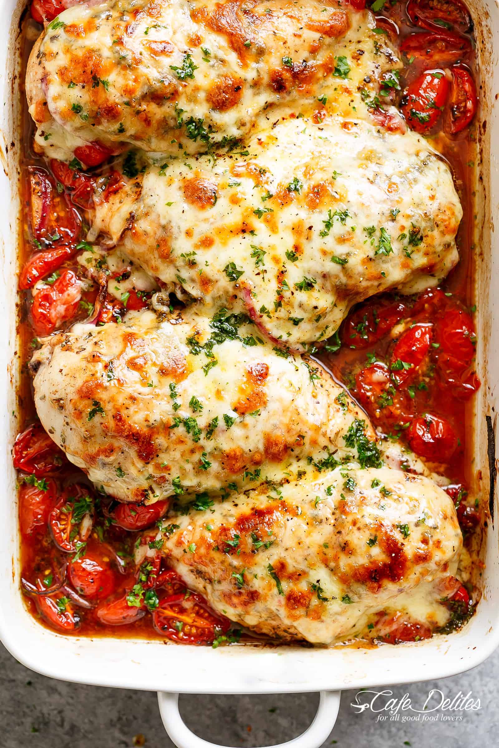 Balsamic Baked Chicken Breast rubbed with garlic and herbs, dripping with a tomato balsamic sauce and melted mozzarella cheese! It doesn't get any better than this EASY chicken recipe! Let your oven do ALL the work and have the most delicious Baked Chicken on your table in less than 30 minutes! | https://cafedelites.com