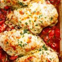 Balsamic Baked Chicken Breast rubbed with garlic and herbs, dripping with a tomato balsamic sauce and melted mozzarella cheese! It doesn't get any better than this EASY chicken recipe! Let your oven do ALL the work and have the most delicious Baked Chicken on your table in less than 30 minutes! | https://cafedelites.com