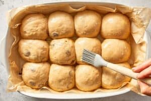 baked chocolate hot cross buns with chocolate crosses and glaze