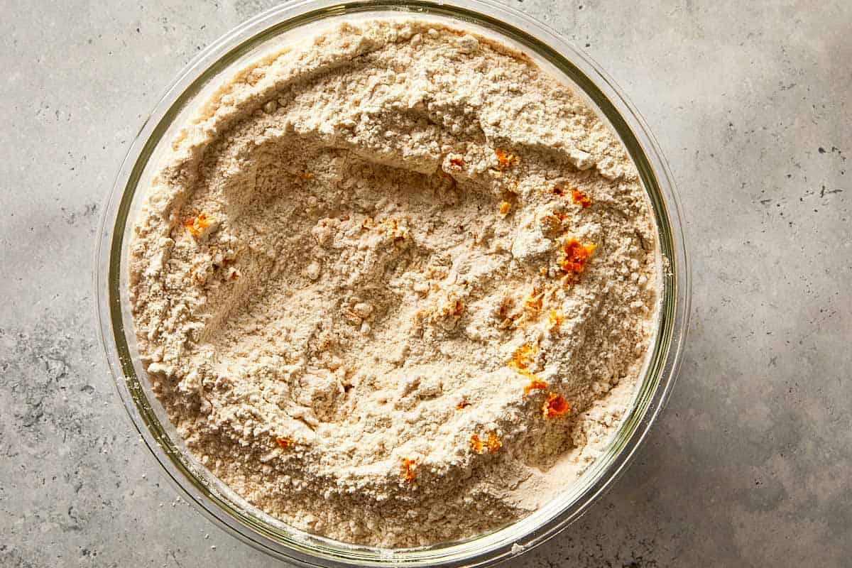 dry ingredients with chocolate chips and spices mixed in a bowl