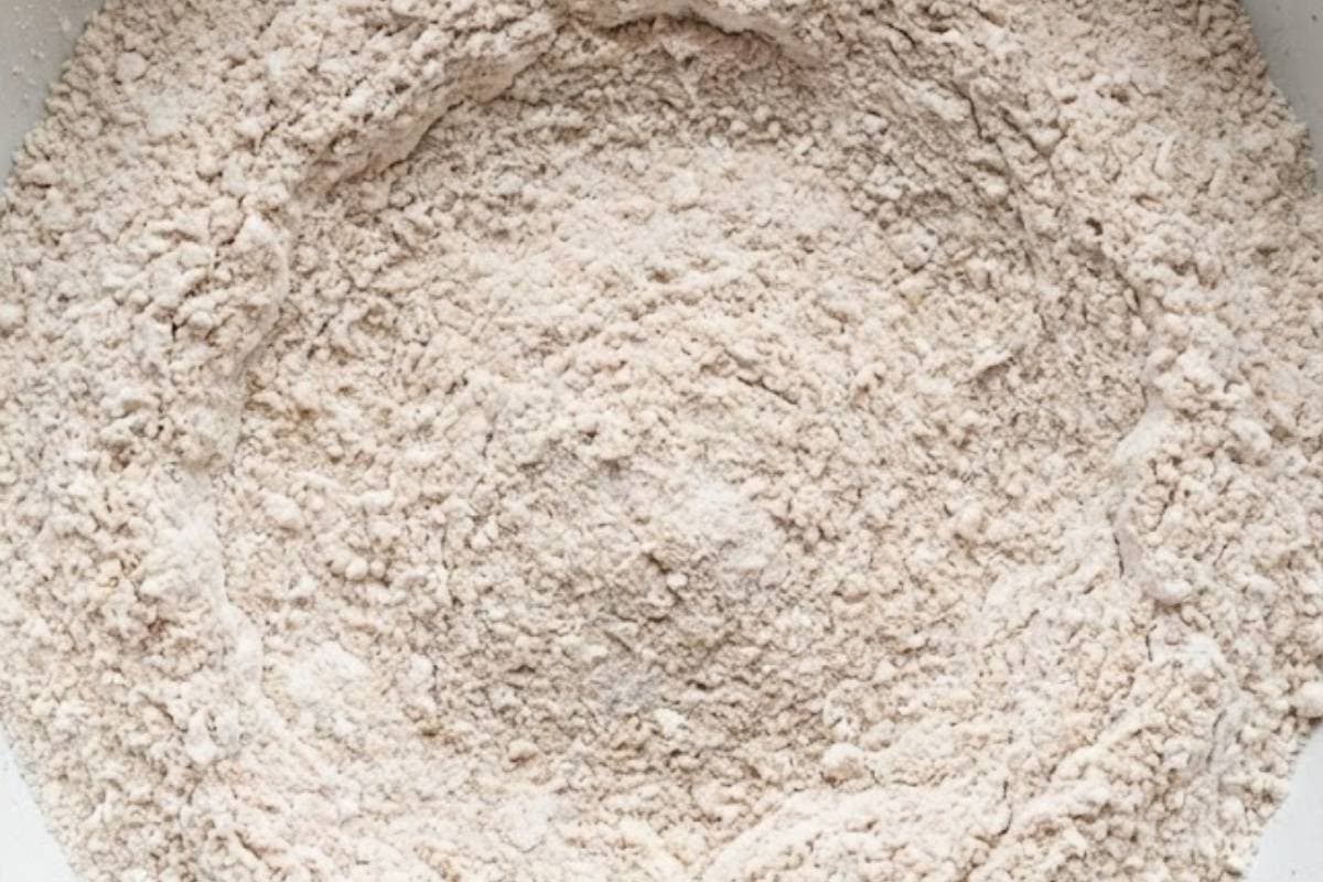 Sift the flour into a large bowl, add the yeast, sugar, salt, cinnamon, and all spice