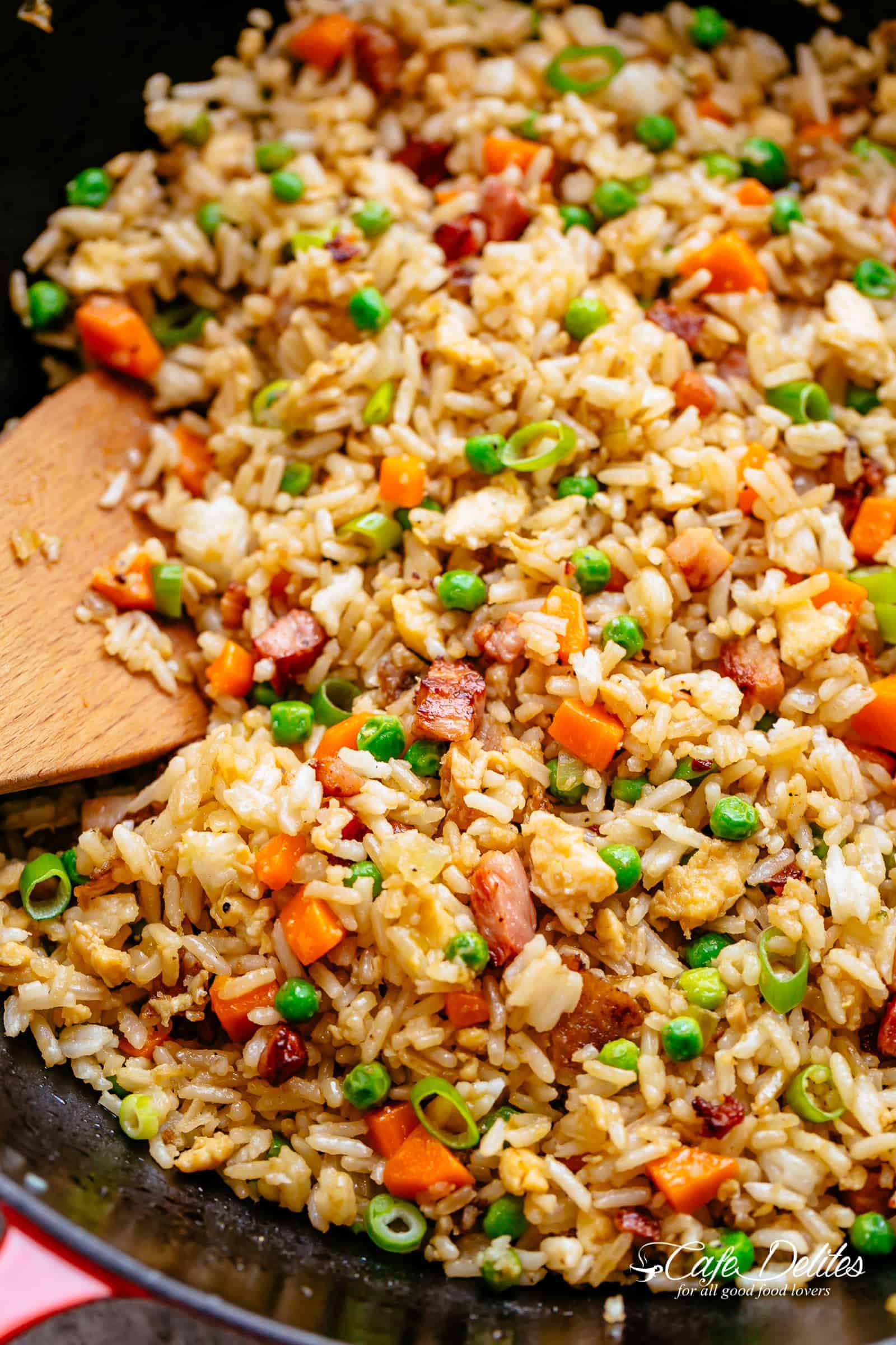 Fried Rice with crispy bacon and fluffy eggs is better than take out and so easy to make! Why go out when you can have the best fried rice right at home! Just like Chinese take out fried rice. Perfect for when you have leftover rice OR make it quick from scratch with a few tricks! | cafedelites.com