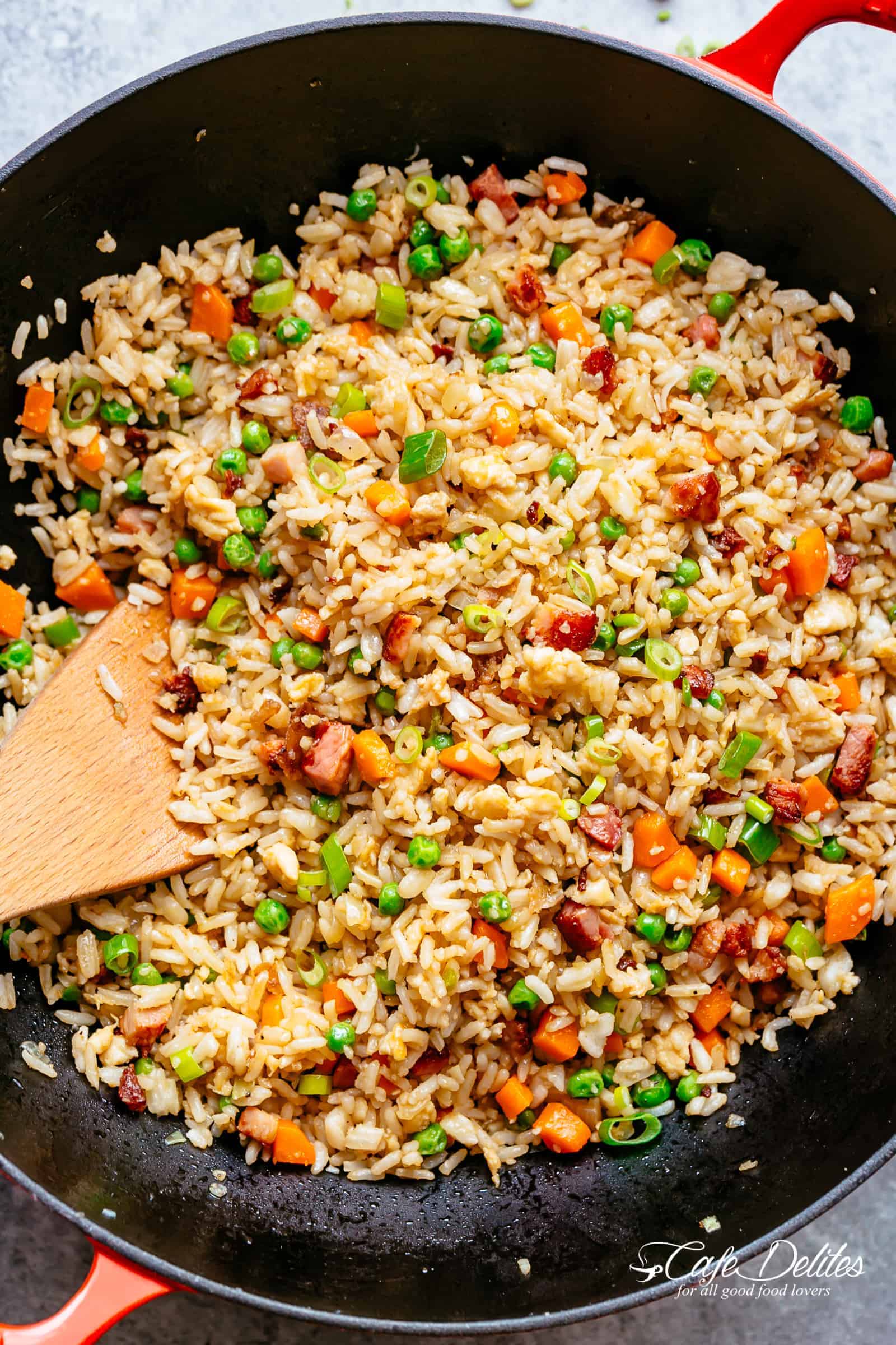 Fried Rice with crispy bacon and fluffy eggs is better than take out and so easy to make! Why go out when you can have the best fried rice right at home! Just like Chinese take out fried rice. Perfect for when you have leftover rice OR make it quick from scratch with a few tricks! | cafedelites.com