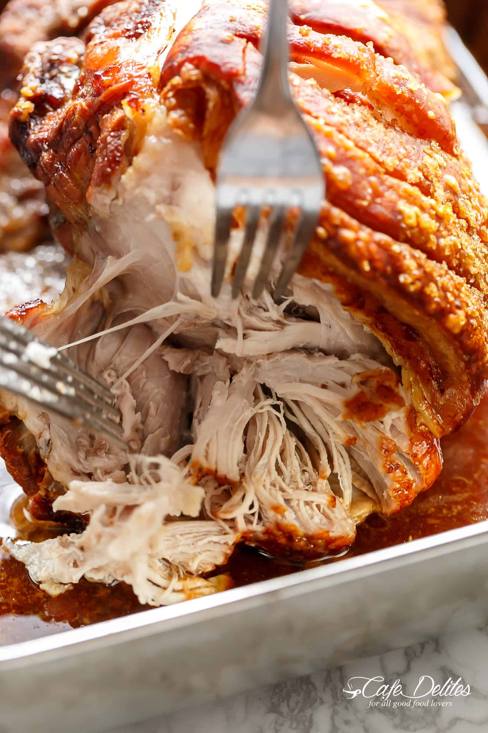 The Most Perfect Pork Roast With Crackling to hit your weekend or holiday table! Roasting a pork shoulder or butt is so easy, but to get the crackle makes it all the more worth every minute waiting! #pork #roast #sunday #easyrecipes #dinner | cafedelites.com