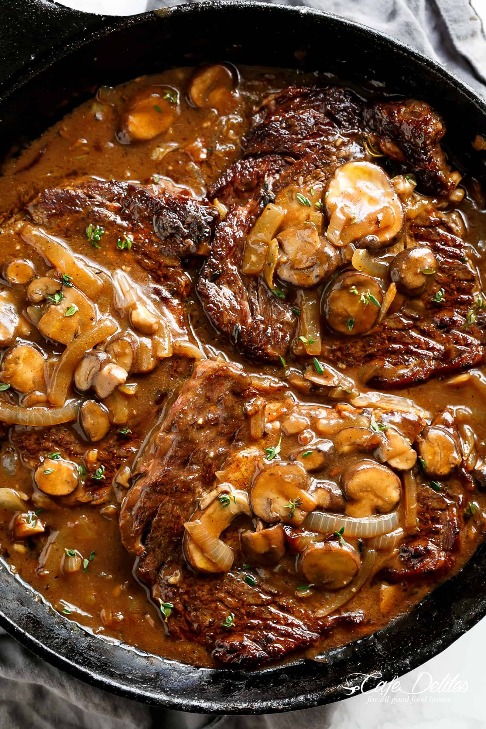Ribeye Steaks With Mushroom Gravy is simple and delicious with a quick and easy homemade gravy made from scratch in 5 minutes! | cafedelites.com