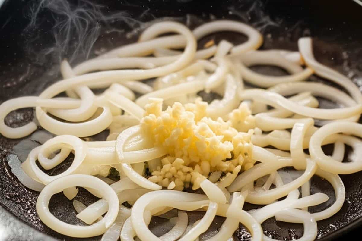 Onion and garlic in a skillet.