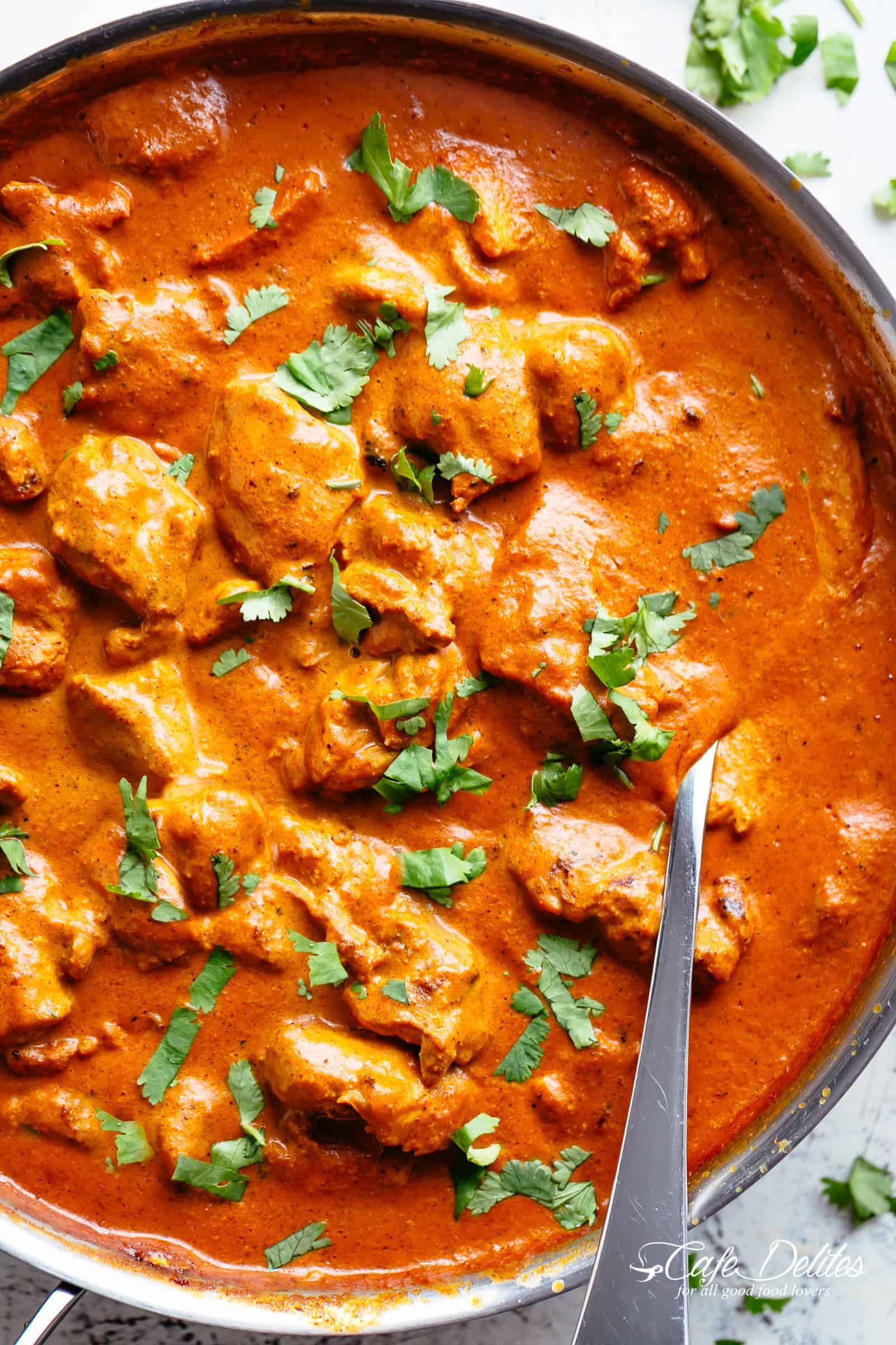 Chicken Tikka Masala is creamy and easy to make right at home in one pan with simple ingredients!Full of incredible flavours, it rivals any Indian restaurant! Aromatic golden chicken pieces in an incredible creamy curry sauce, this Chicken Tikka Masala recipe is one of the best you will try! | cafedelites.com