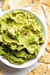 The best, creamy Guacamole is so easy to make and better than anything found in a jar! Homemade Guacamole takes minutes to make and is so incredibly delicious! Perfect for a party as an appetizer OR just a simple snack! Use as a topping for your favourite fajitas, tacos and even carnitas! | cafedelites.com