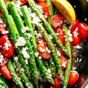 Lemon Garlic Asparagus topped feta cheese, tomatoes and drizzled with Mediterranean flavours