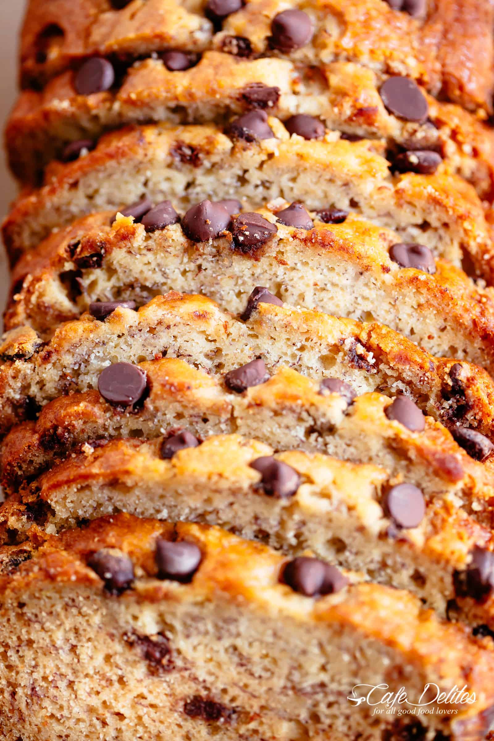 The Best Fluffy Banana Bread with chocolate chips or chopped nuts is not only the best way to use up over-ripe bananas, but it's possibly the best slice to go with your morning coffee! Better than anything store-bought, our banana bread is buttery, moist and smells amazing while baking! Every bite is pure heaven! | cafedelites.com